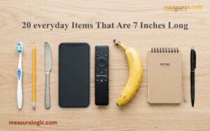 A neat flat lay of a toothbrush, pencil, knife, smartphone, remote, banana, and notebook on a light wooden desk featuring items that are 7 inches long.